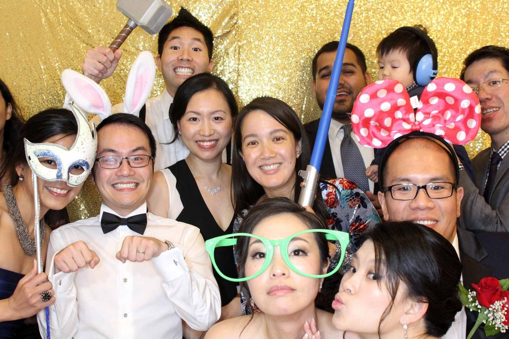 group of friends partying at thephoto booth